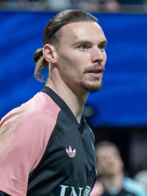 Maarten Vandevoordt in a Belgium training top, looking across the pitch